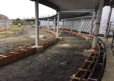 Sidewalk edge footings at curved walkway