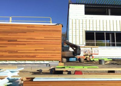 Wood siding at Back of House and Studio A overhang