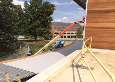 Sound attenuating concrete on walkway deck outside Studio A