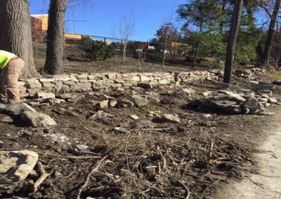 Rebuilding of stone wall along Hawthorne Road -- Center for Music and Learning