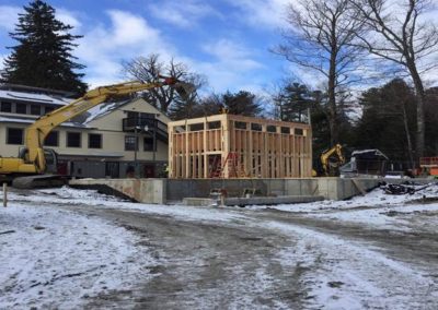 Wall panels being erected on toilet building